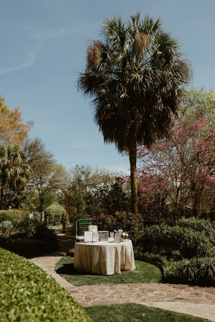 Outdoor wedding ceremony under oak trees at The Hummingbird House Austin wedding venue