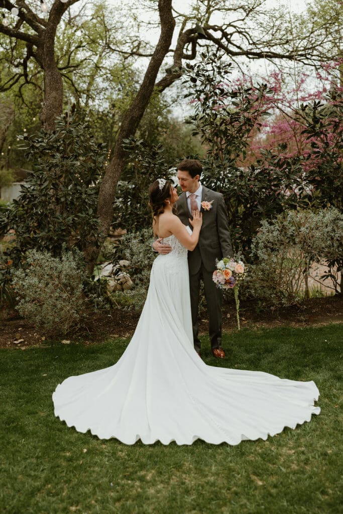 Outdoor wedding portraits in the gardens at The Hummingbird House venue near Austin
