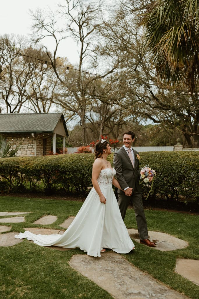 Outdoor wedding portraits in the gardens at The Hummingbird House venue near Austin
