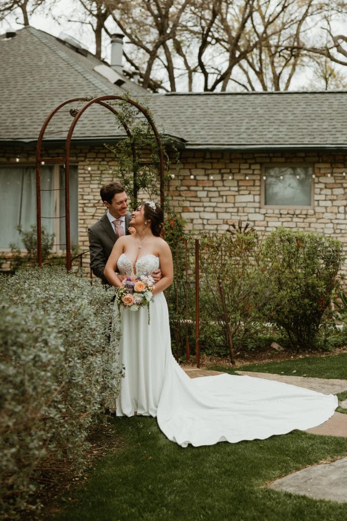 Outdoor wedding portraits in the gardens at The Hummingbird House venue near Austin
