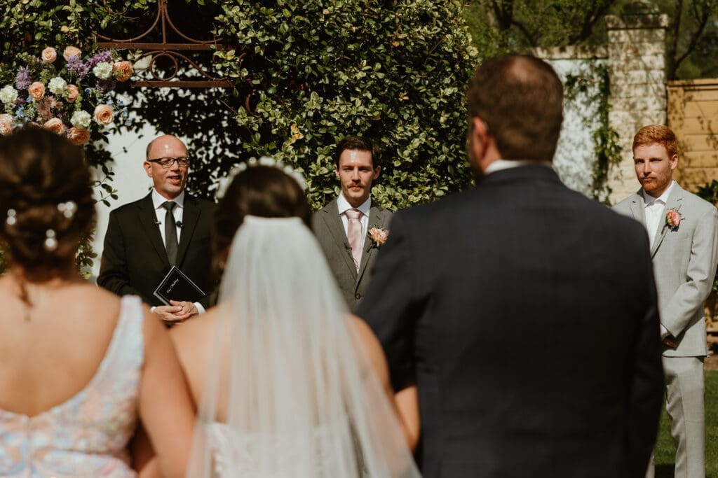 Groom seeing his bride for the first time while walking down the ceremony aisle at The Hummingbird House in Central TX