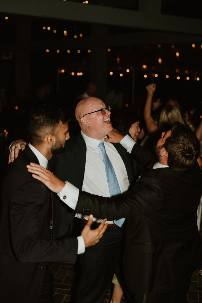 Candid moments of guests at a wedding reception at The Umlauf Sculpture Garden in Austin