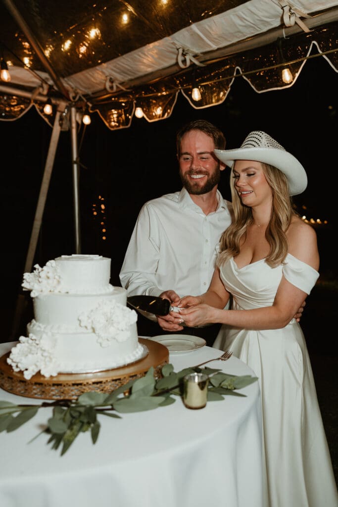 Bride and groom enjoying their cake cutting on a Spring evening outdoor at an Austin Texas wedding venue