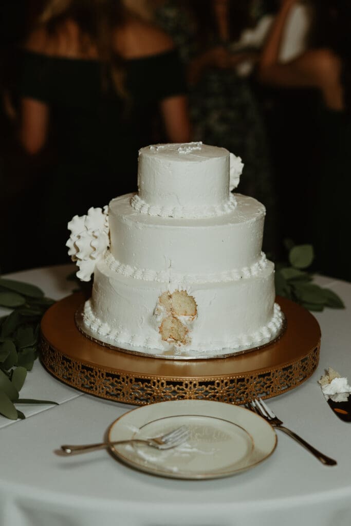 Bride and groom enjoying their cake cutting on a Spring evening outdoor at an Austin Texas wedding venue