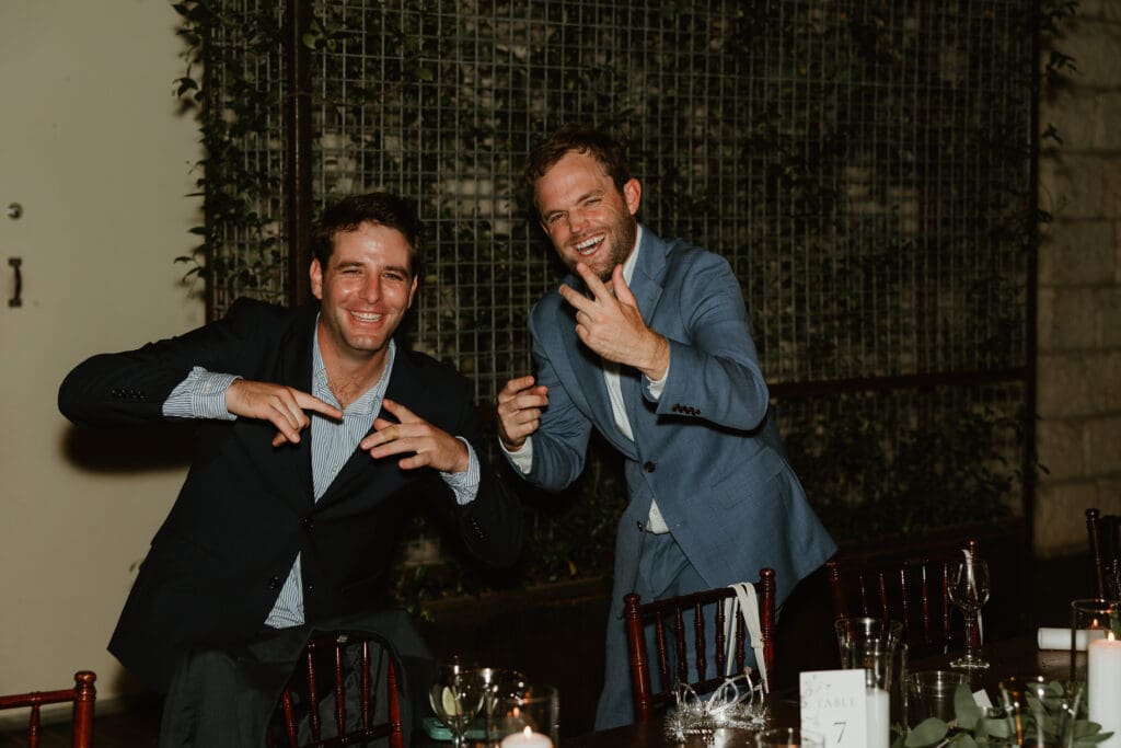 Candid moments of guests at a wedding reception at The Umlauf Sculpture Garden in Austin
