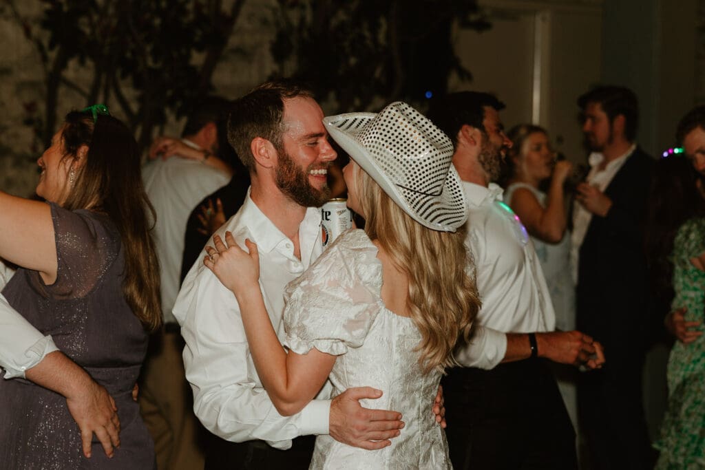Candid moments of guests at a wedding reception at The Umlauf Sculpture Garden in Austin
