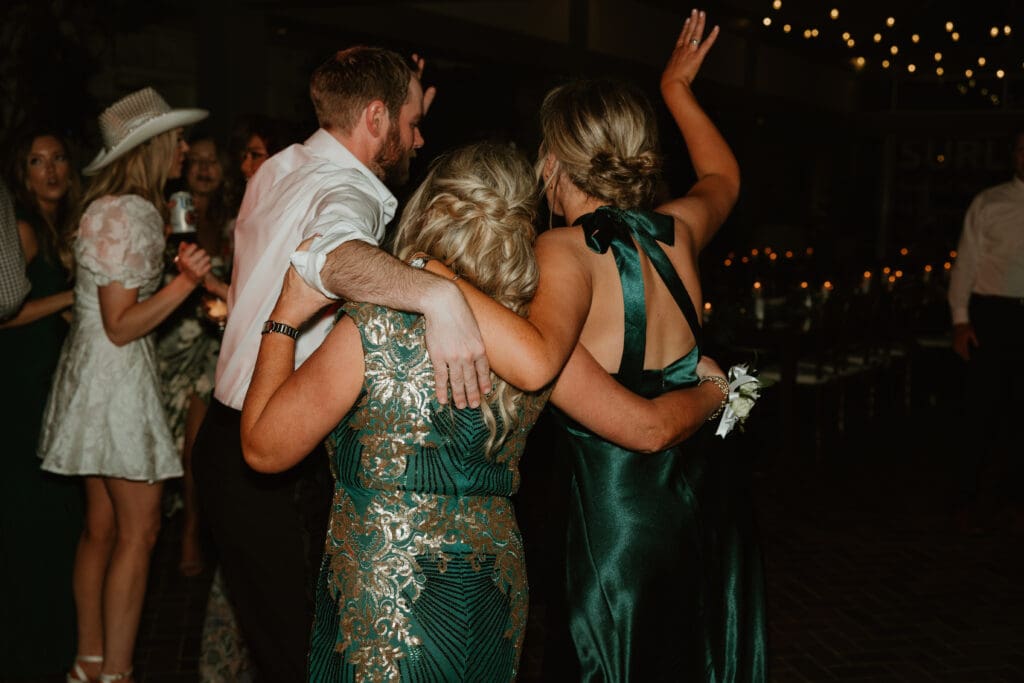 Candid moments of guests at a wedding reception at The Umlauf Sculpture Garden in Austin