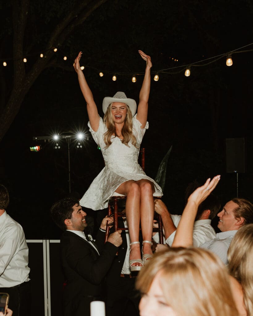 Candid moments of guests at a wedding reception at The Umlauf Sculpture Garden in Austin