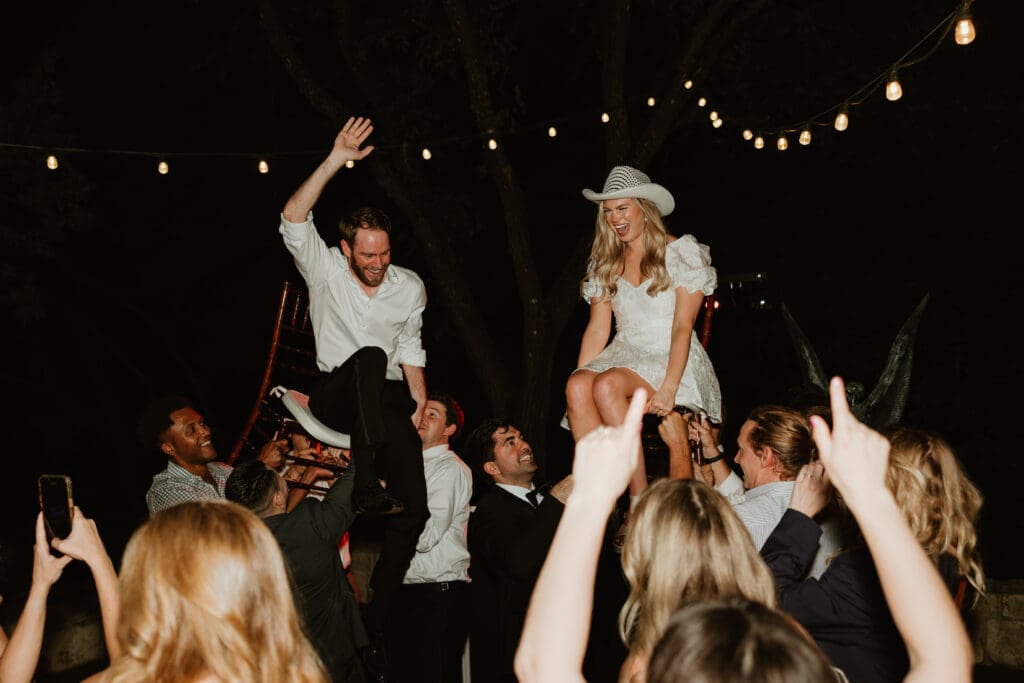 Candid moments of guests at a wedding reception at The Umlauf Sculpture Garden in Austin