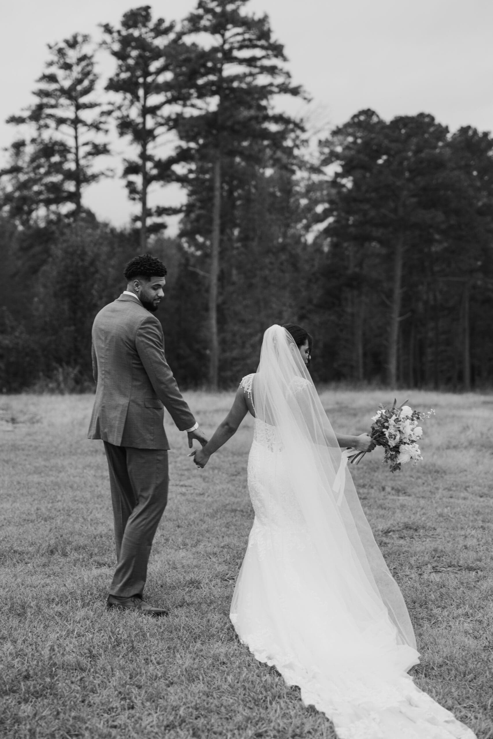 Bride and groom enjoying alone time at Sunset Oaks Venue in East Texas