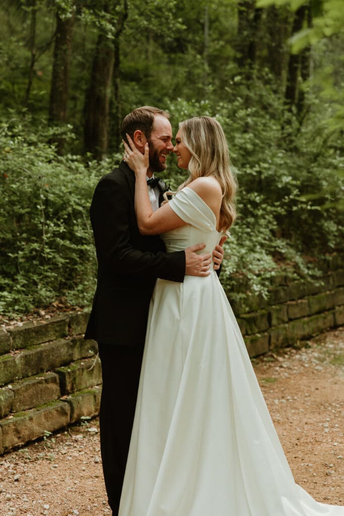 Outdoor bride and groom portraits in lush pathway during Spring in Austin Texas