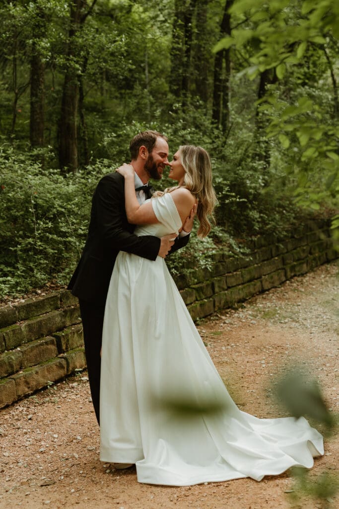 Outdoor bride and groom portraits in lush pathway during Spring in Austin Texas
