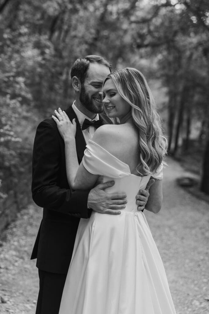 Bride and groom nuzzle together during portraits in Austin Texas