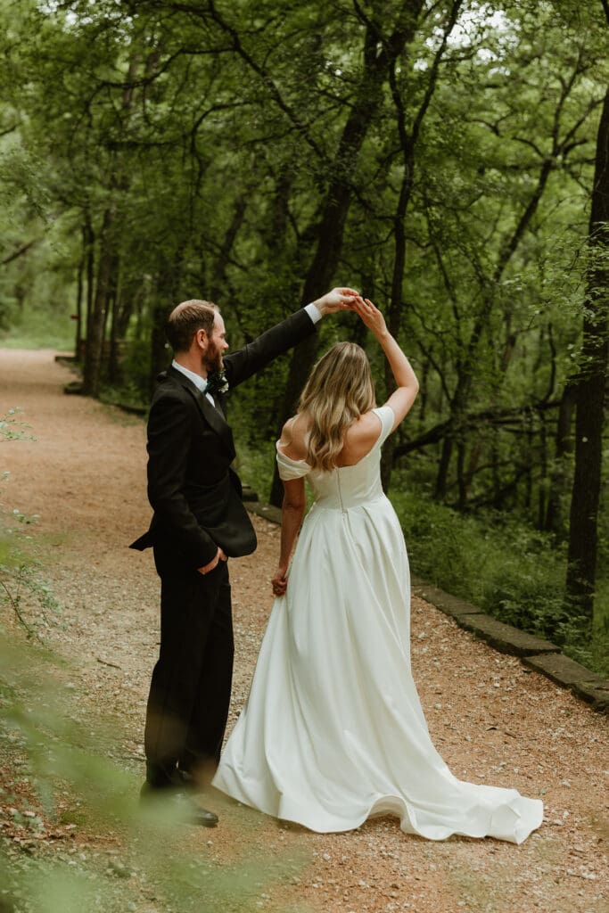 Bride and groom have a private dance in lush pathway during Spring in Austin Texas