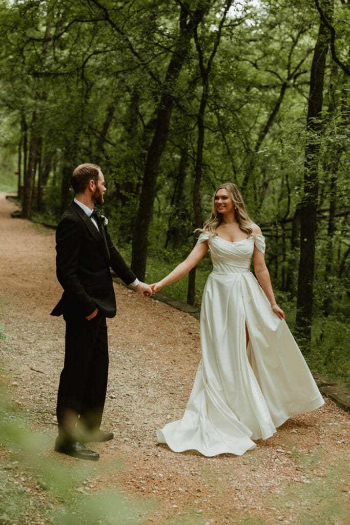 Bride and groom have a private dance in lush pathway during Spring in Austin Texas