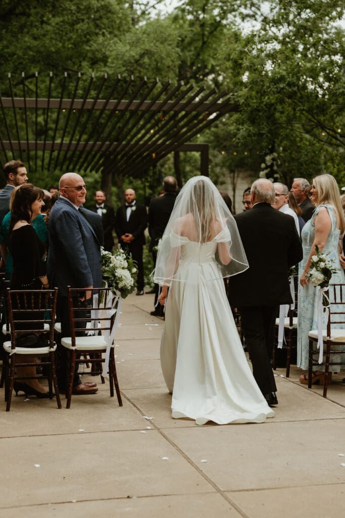 Lush wedding ceremony at Umlauf Sculpture garden in Austin, Texas