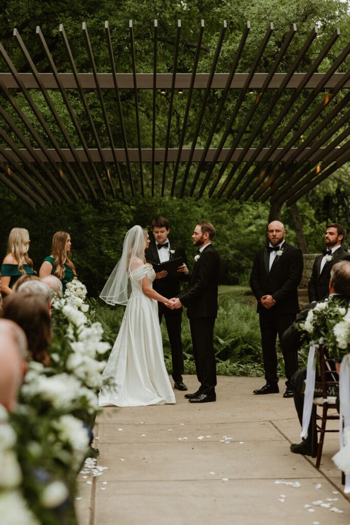 Lush wedding ceremony at Umlauf Sculpture garden in Austin, Texas