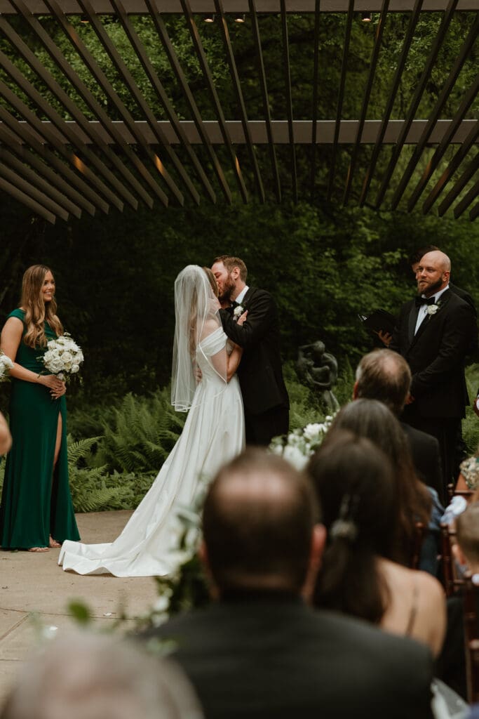 Lush spring wedding ceremony at The Umlauf Sculpture Garden in Austin