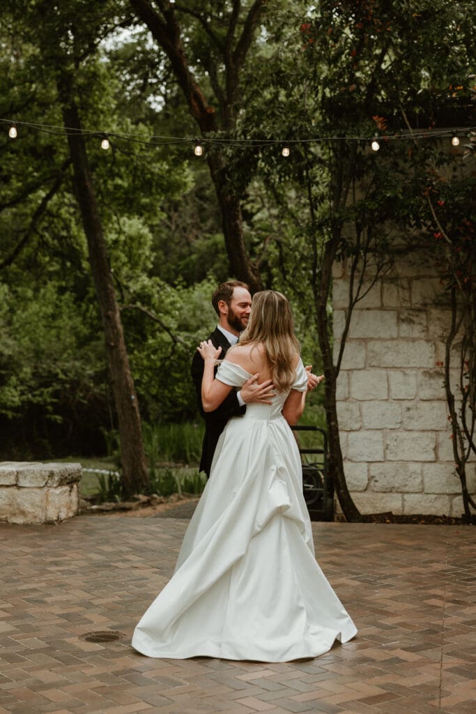 Bride and groom first dance at The Umlauf Sculpture Garden in Austin