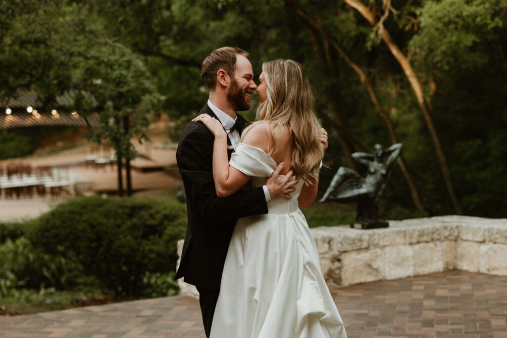 Bride and groom having a first dance at The Umlauf Sculpture Garden in Austin