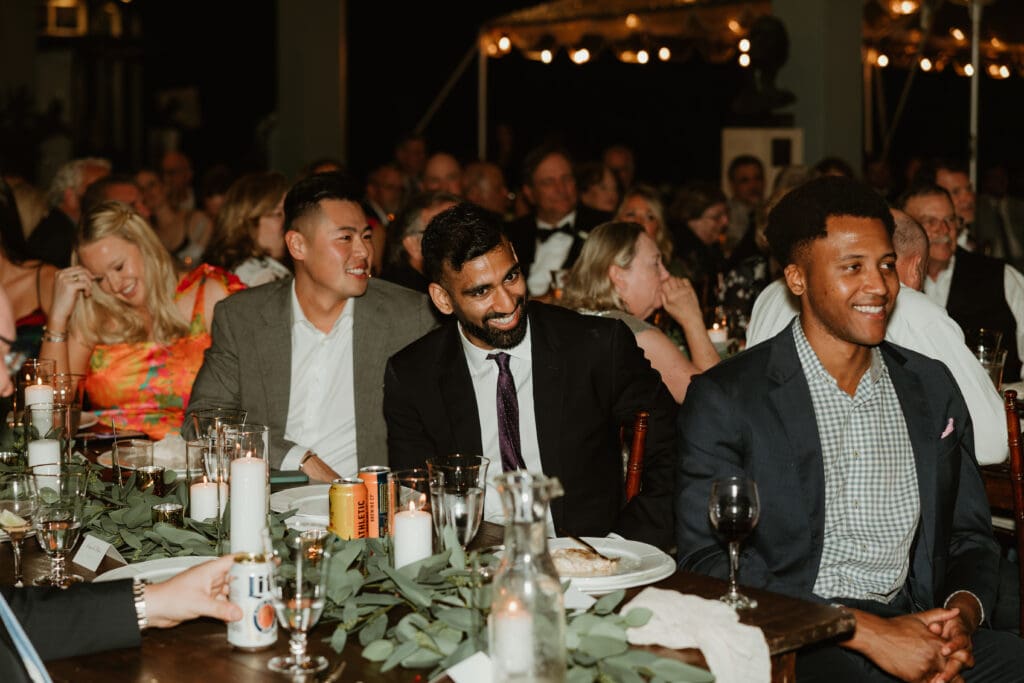 Candid moments of guests at a wedding reception at The Umlauf Sculpture Garden in Austin