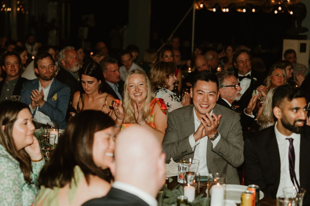 Candid moments of guests at a wedding reception at The Umlauf Sculpture Garden in Austin