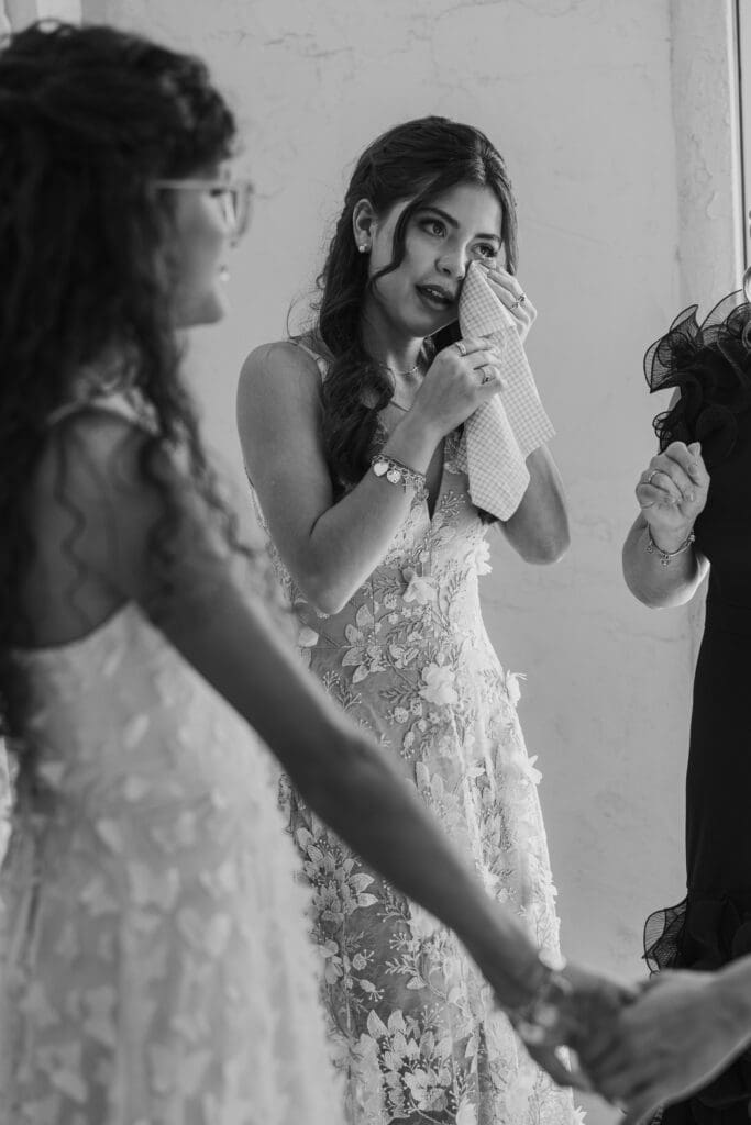 Candid moments of bridesmaid tearing up at Villa Antonia in Austin, Texas.