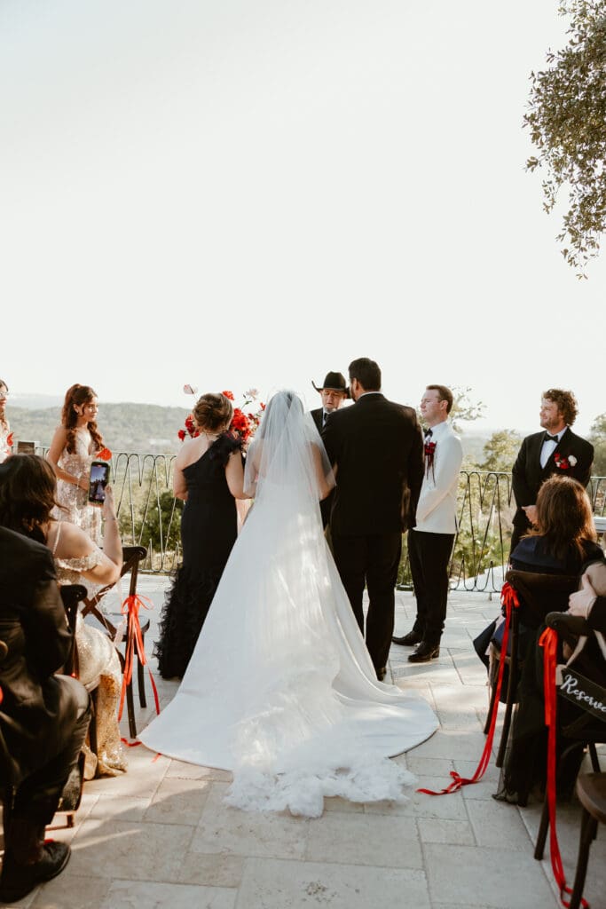 Bride and mother candid moments during the walk down the aisle at Villa Antonia in Austin, Texas. 