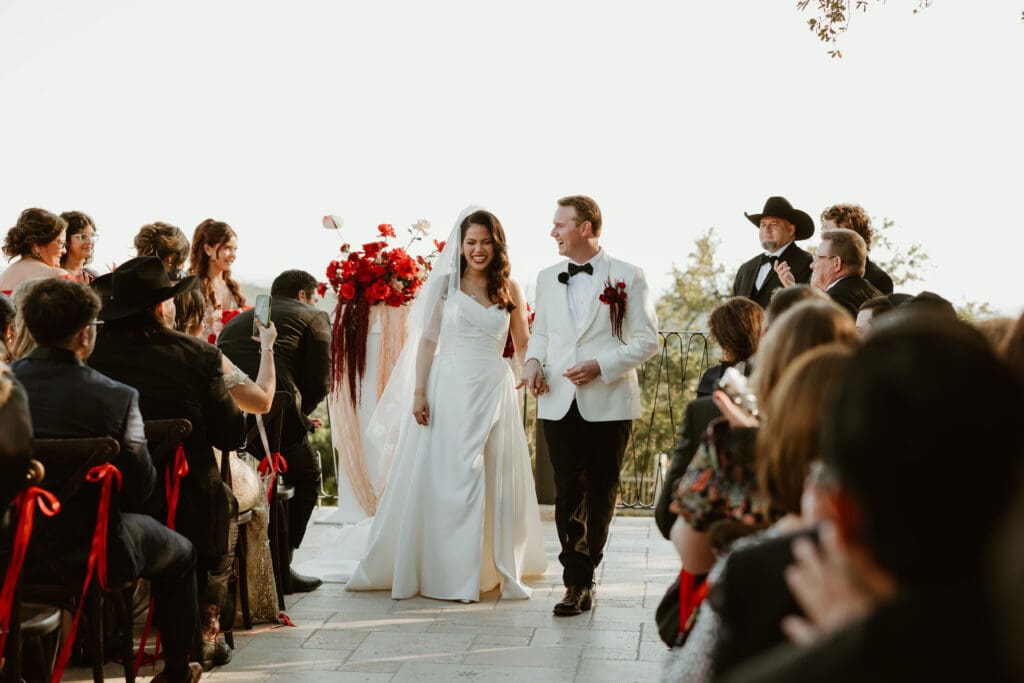 Bride and groom celebrate their marriage on the outdoor terrace at Villa Antonia.
