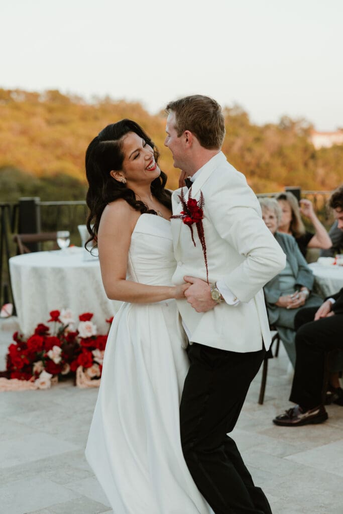 Bride and groom dance into the sunset on the outdoor terrace at Villa Antonia.
