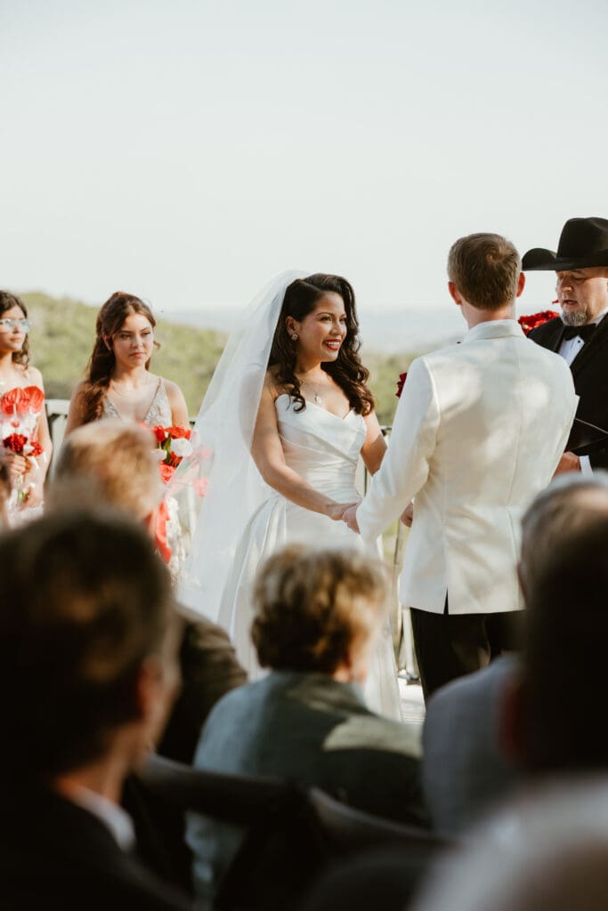 Bride and groom exchanging vows on the outdoor terrace at Villa Antonia.

