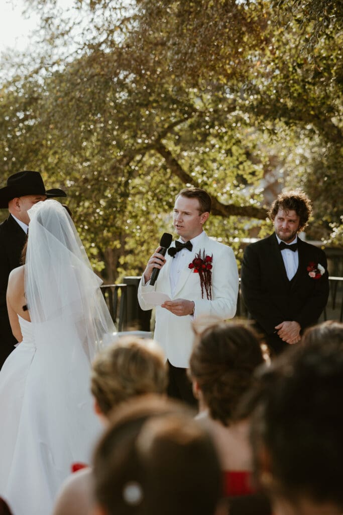 Bride and groom exchanging vows on the outdoor terrace at Villa Antonia.

