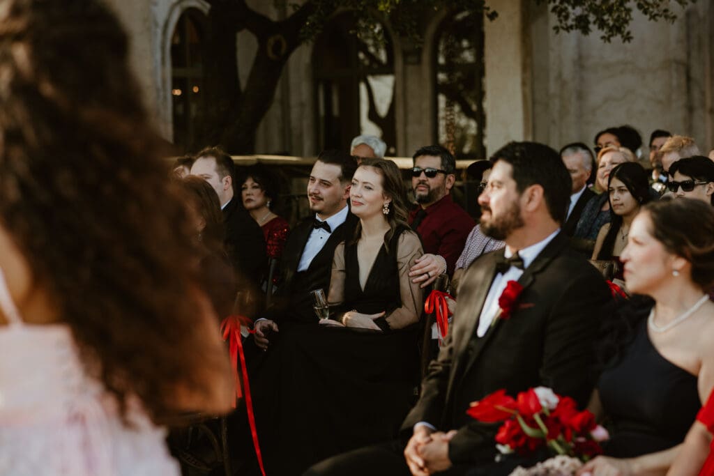 Candid moments of guests during wedding ceremony on Villa Antonia terrace. 