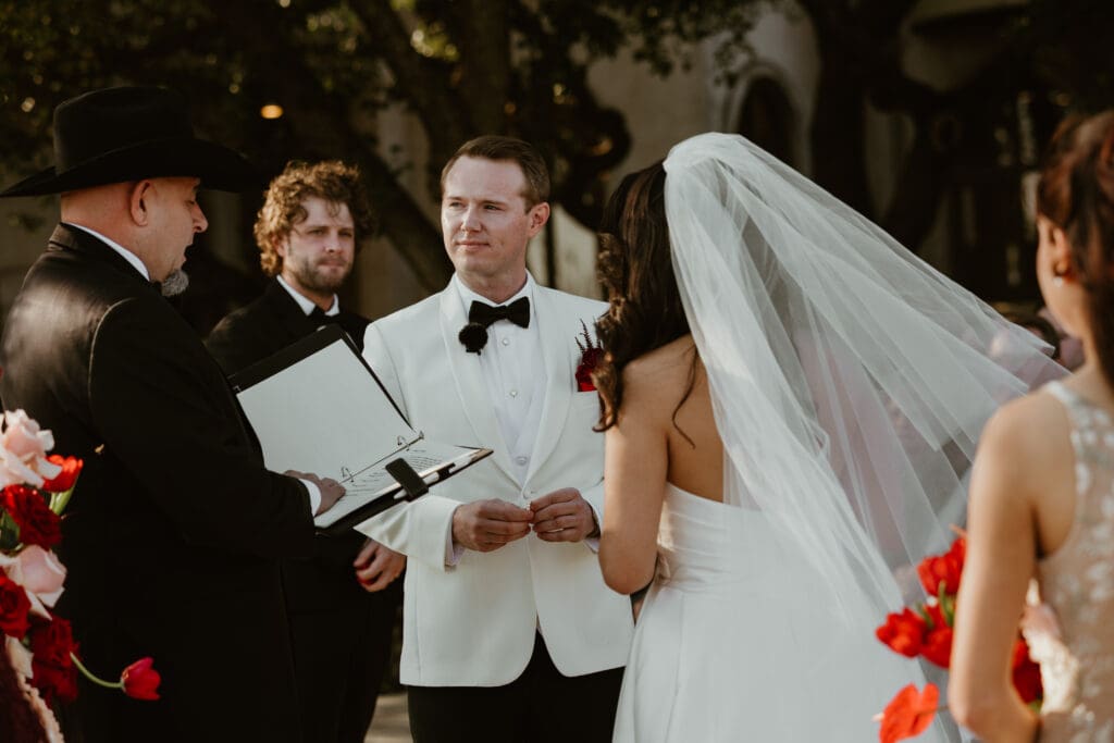 Bride and groom exchanging vows on the outdoor terrace at Villa Antonia.

