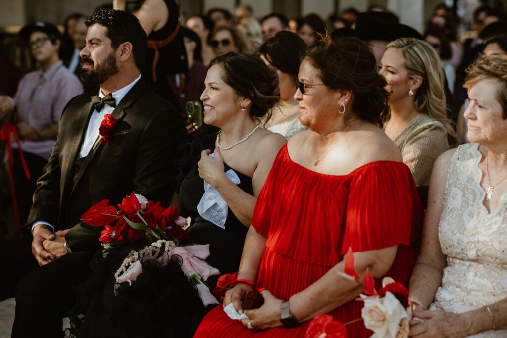 Candid moments of guests during wedding ceremony on Villa Antonia terrace. 
