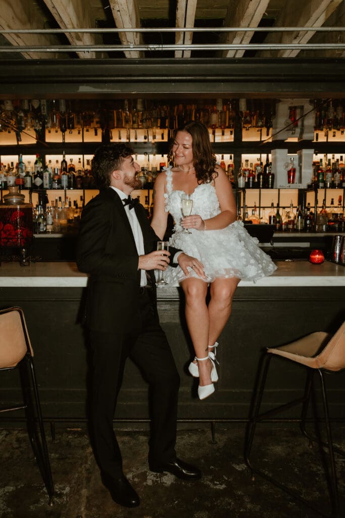 Engaged couple share a toast in downtown Austin speakeasy.
