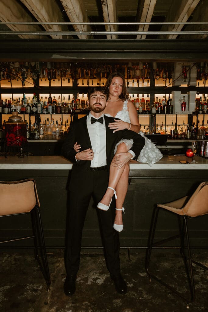 Engaged couple dressed to the nines in downtown Austin bar