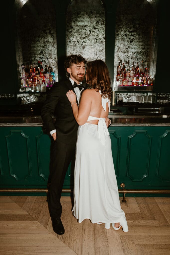Engaged couple share a moment in downtown Austin bar