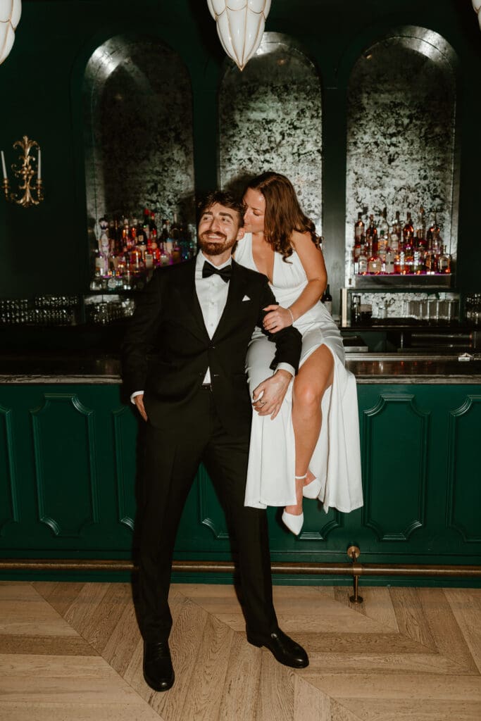 Engaged couple dressed old money meets new money in downtown Austin bar.
